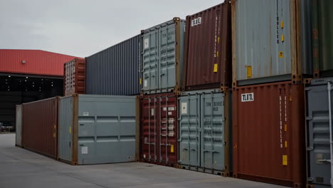stacked shipping containers at a logistics terminal