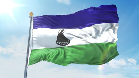 bandera de lesotho ondeando en el viento contra el cielo azul profundo. tema nacional, concepto internacional. render 3d bucle sin costuras 4k