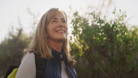 Active-senior-woman-smiling-in-forest