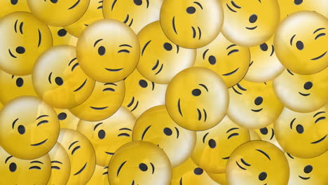 animation of falling emojis over woman in hijab using smartphone