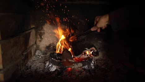 preparing burning firewoods for the barbecue