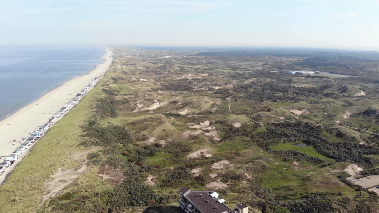 Aerial 4k drone footage of the coastline near the town of Wijk aan Zee in North Holland, the Netherlands.