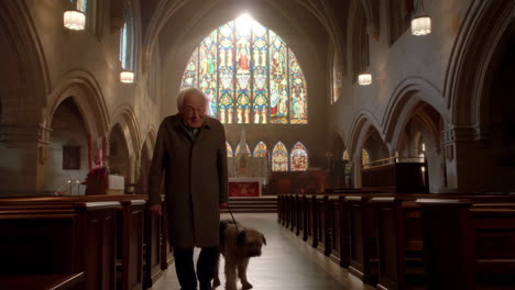 man and dog in church