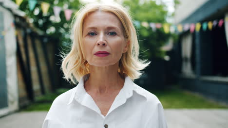 portrait of a happy woman in a garden