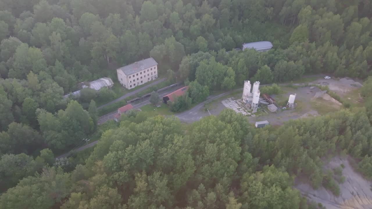 Aerial view of industrial buildings in a forest