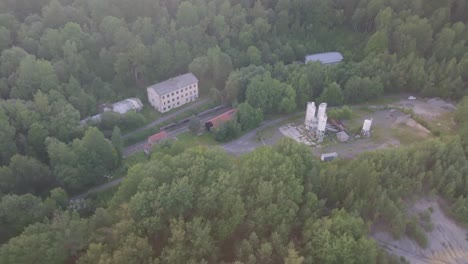 aerial view of industrial buildings in a forest