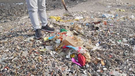 collecting plastic waste in carter road beach mumbai india closeup shot