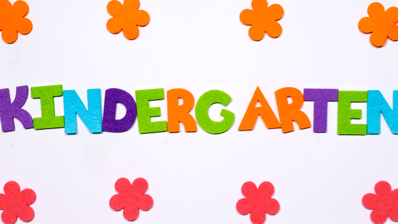 The word kindergarten is written in dancing letters of the colored alphabet.
