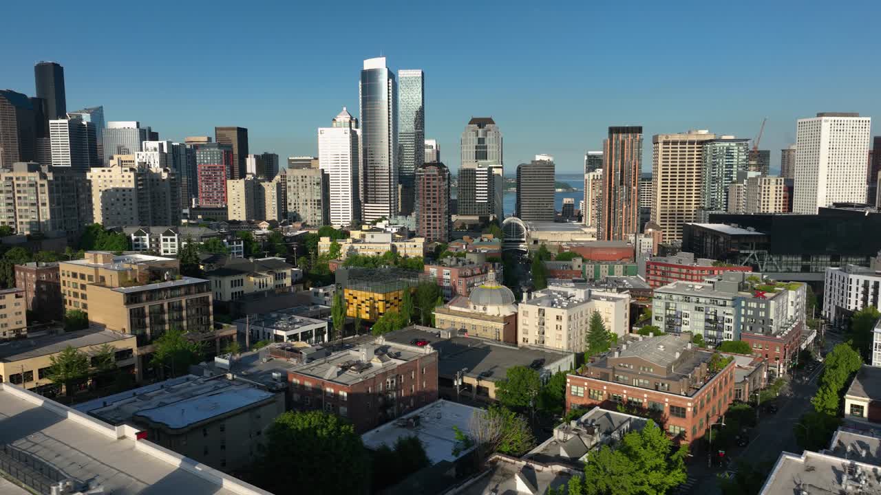 Seattle's First Hill neighborhood withe the city's skyscrapers looming in the distance at sunrise