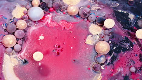 vibrant ink drops floating in water with a captivating mixture of colors and bubbles