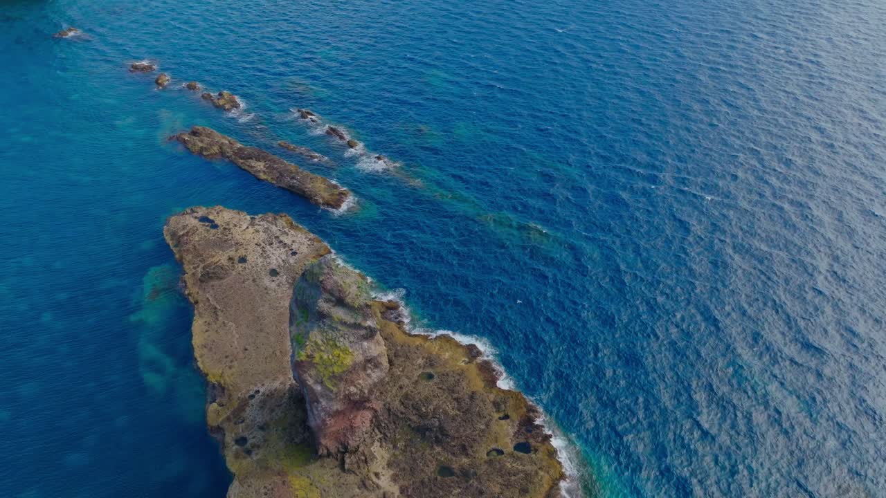Aerial fly around cliff island landscape in Japanese Sea, at Shakotan Hokkaido, scenic coastline