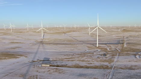 Aerial-shots-of-wind-turbines-on-a-cold-winter-afternoon-in-Calhan,-Colorado