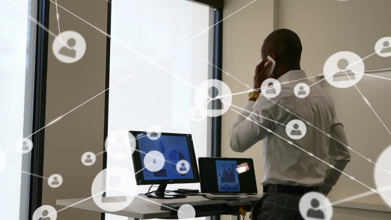 Animation of network of profiles over man talking on smartphone while walking on treadmill at office