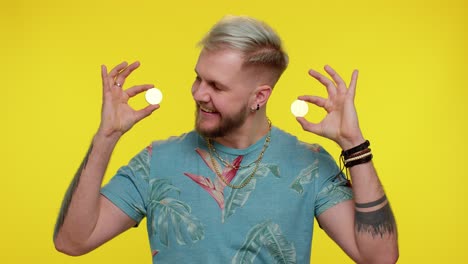 man holding bitcoin coins