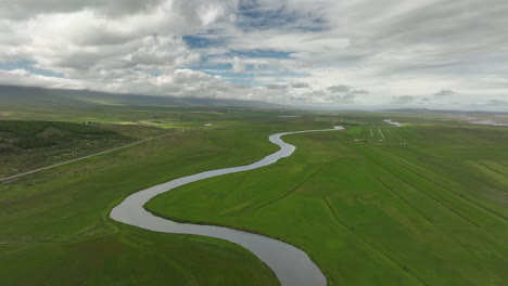 beautiful winding river in iceland countryside aerial shot cloudy day