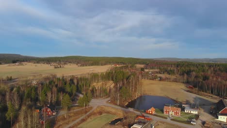 drone shot over farm, pond and gravel pit