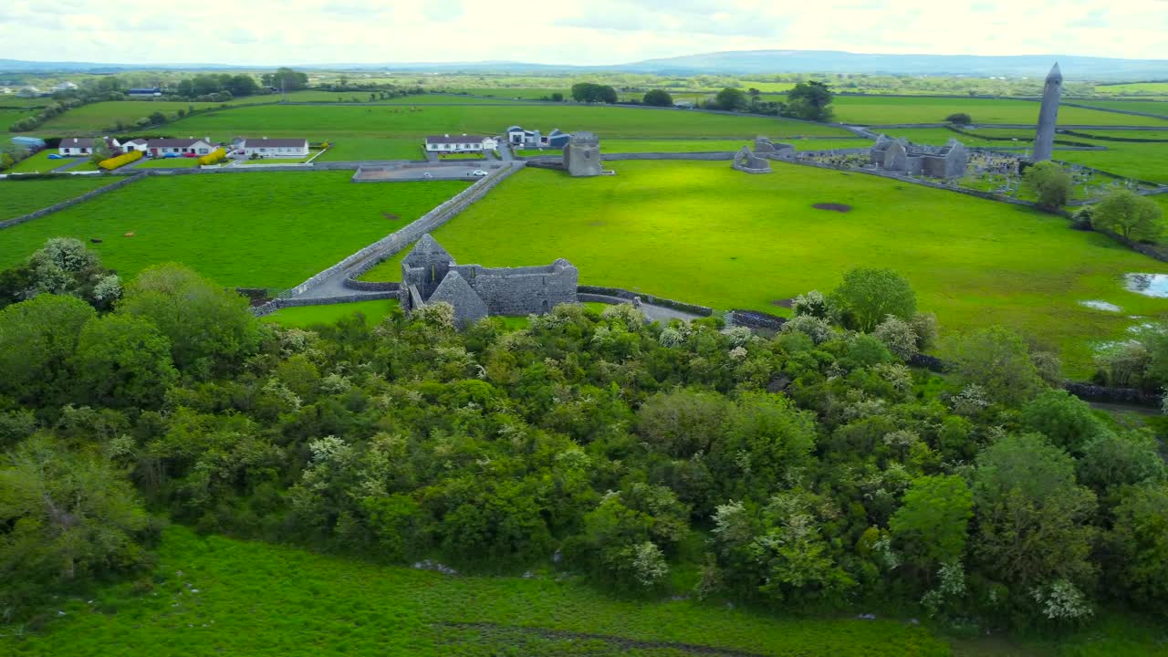 Aerial spin shot of Kilmacduagh abbey and nearby monastic ruins.