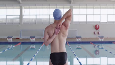 swimmer stretching at swimming pool