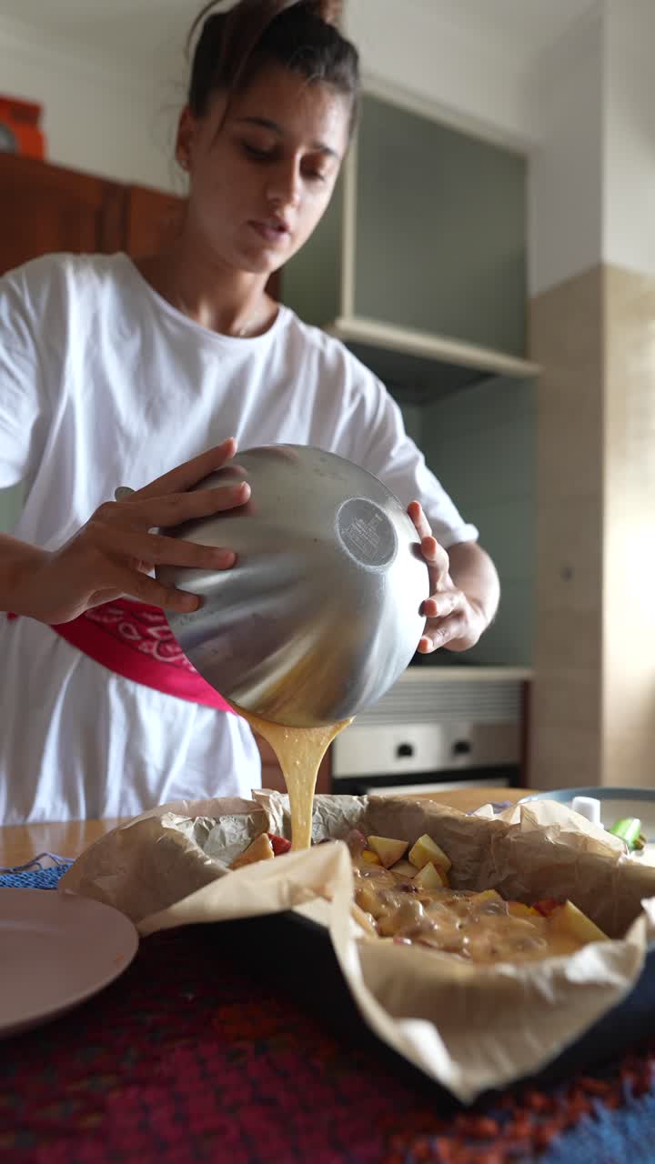 Woman baking a dessert in the kitchen