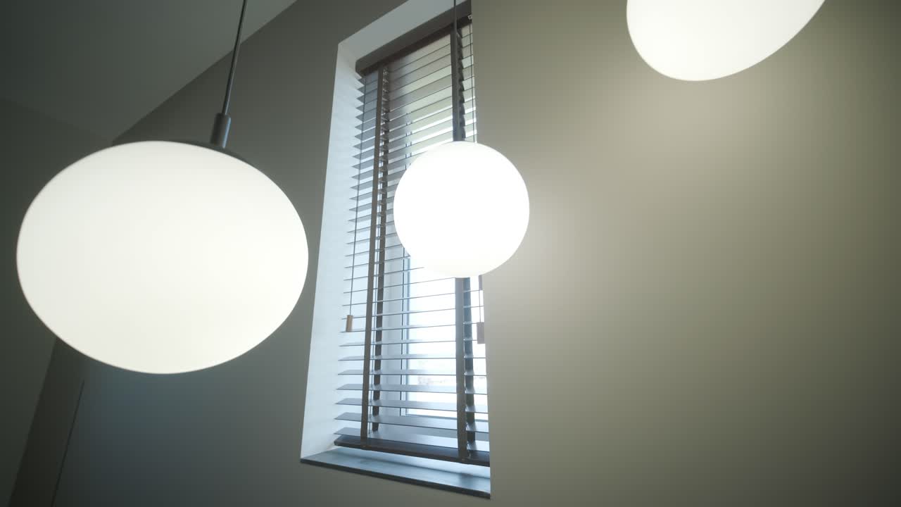 luces colgantes de globo modernas en una habitación minimalista