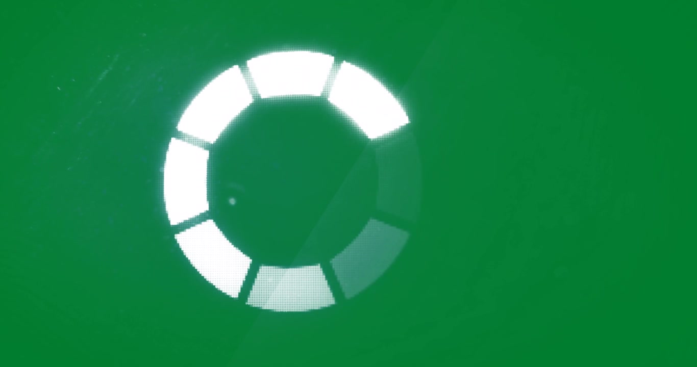 Animation of white loading circle segments moving on black background