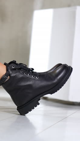 lifestyle shoe boutique. stylish woman footwear demonstration. vertical video