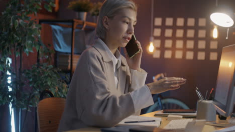 Woman on phone call at her desk