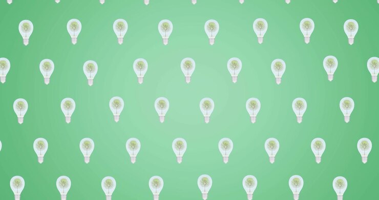Animation of multiple falling light bulbs with trees inside on green background