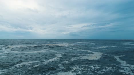 ocean waves breaking on coast, birds flying over open sea porto portugal city