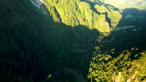 aerial dolly in over andean mountains covered in green dense rain forest in el leon viewpoint, chile