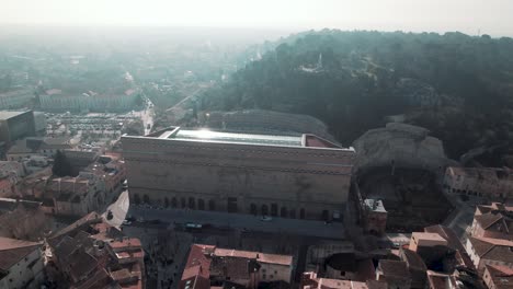 At-dawn,-view-of-the-misty-sky,-the-ancient-theater-of-Orange