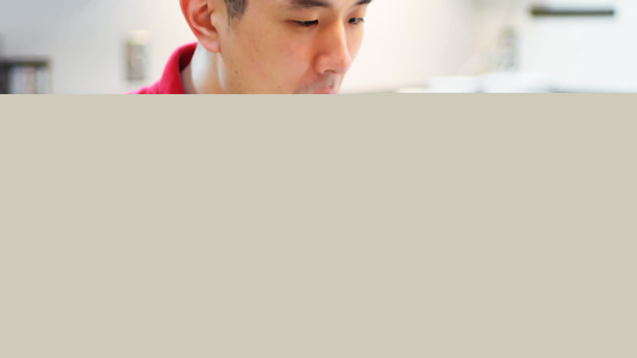 Man using mobile phone while having breakfast