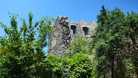 pan right low angle shot of badenweiler castle ruin in sunny day, germany