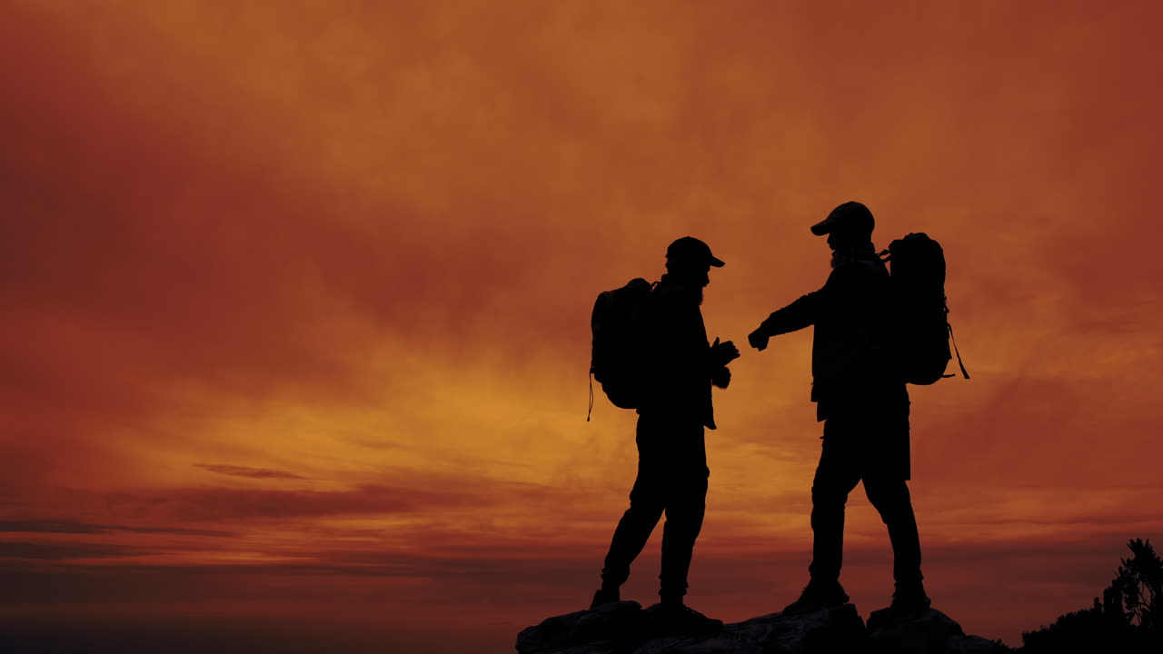 Hikers Silhouetted at Sunset