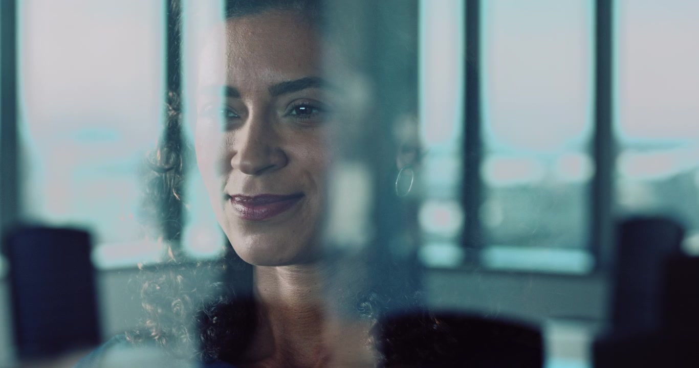 Professional Woman Looking Through Office Window