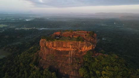 aerial view of sigiriya rock sri lanka sunrise drone footage. distant aerial drone shot of sigiriya rock, sri lanka