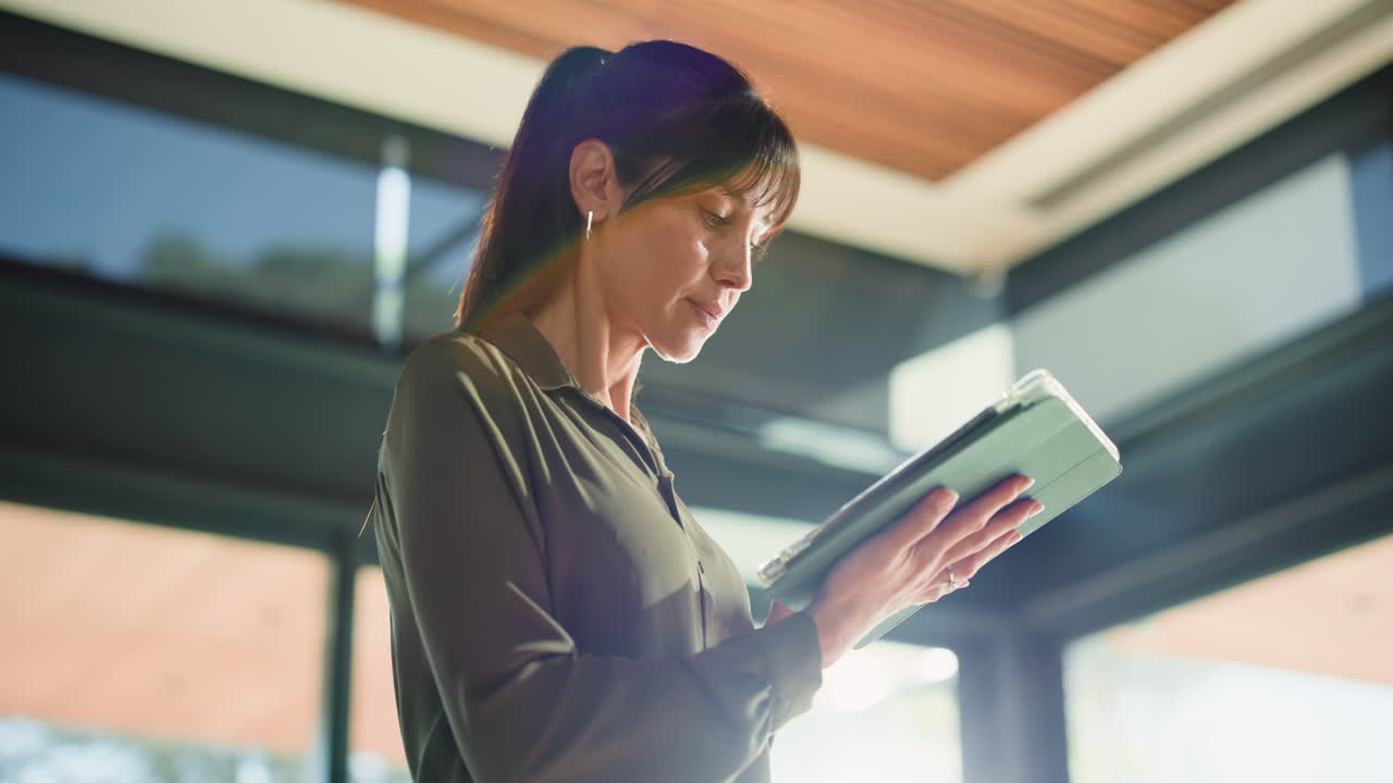 Woman using a tablet indoors
