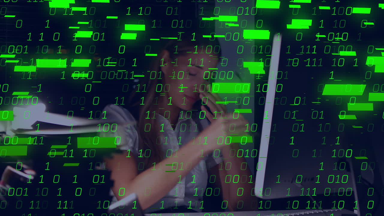 woman office worker holding phone to ear at computer monitor, viewing tech data with binary overlay