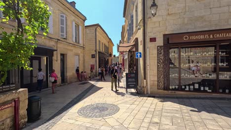 people walking through charming french village