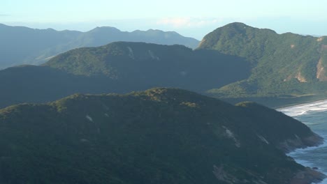 pan over brazilian rainforest and beach at barra de guaratiba in brazil