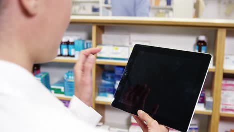 pharmacist using digital tablet