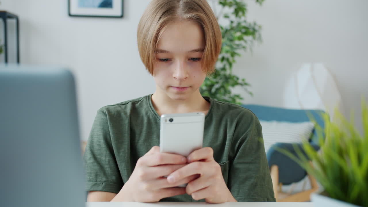 Teenage boy using a smartphone