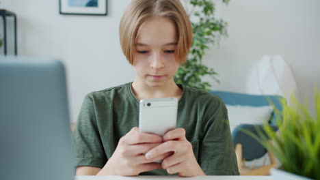 teenage boy using a smartphone