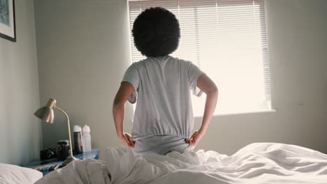 Black-woman,-morning-and-sunshine-window-waking-up