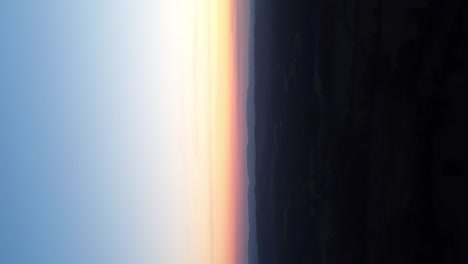 vertical shot colorful sunset sky over rural landscape