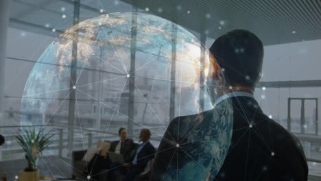 animation of connections and globe over back of caucasian businessman