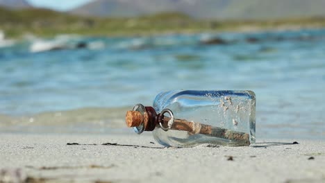 Message-in-the-bottle-against-the-Sun-setting-down