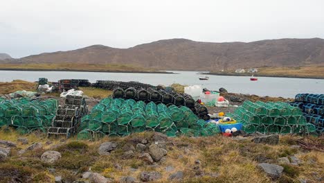 Stack-of-crab-and-lobster-fishing-pots-on-coastline-in-the-remote-isles-of-Outer-Hebrides-in-Scotland-UK