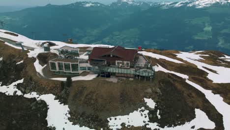 wide panorama circular flight around scenic zillertal skiing hiking sports kristallhütte bergstation cabin near innsbruck towards the snowy glacier mountain tops in the alps on a cloudy and sunny day