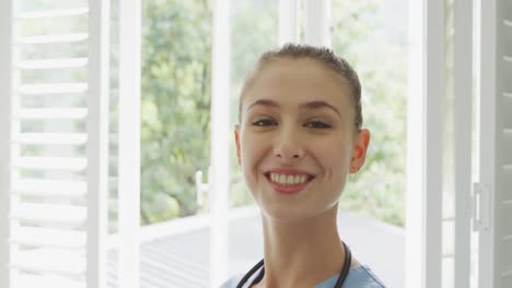 Female-doctor-smiling-to-camera